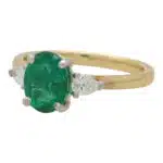 Contemporary Emerald and Pear Cut Diamond Three Stone Ring